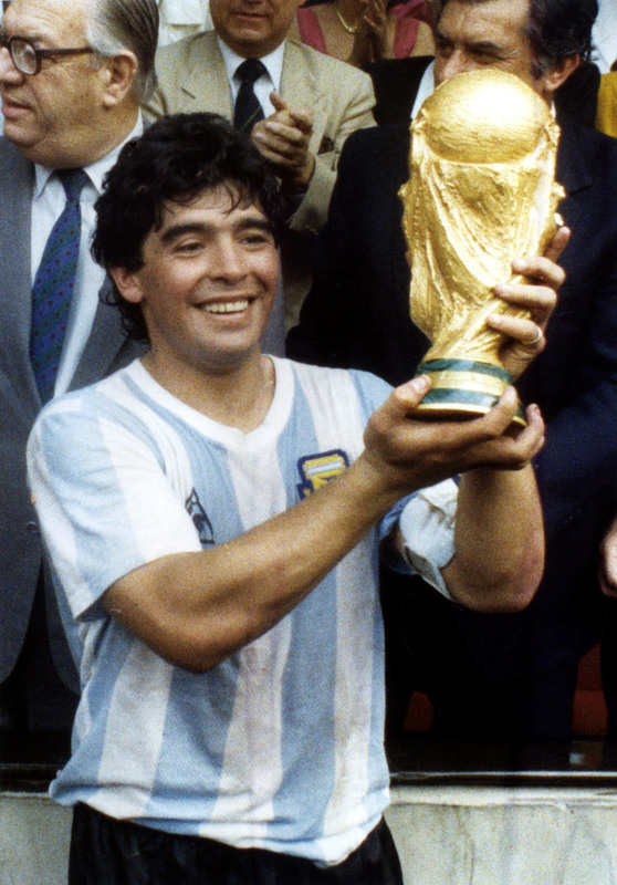 FILED - 29 June 1986, Mexico, Mexico City: Argentina's Diego Maradona holds up the World Cup trophy after his team's victory over West Germany in the 1986 FIFA World Cup Final. Argentina football great Diego Maradona has died at the age of 60, the Argentinian Football Association said on Photo: dpa.